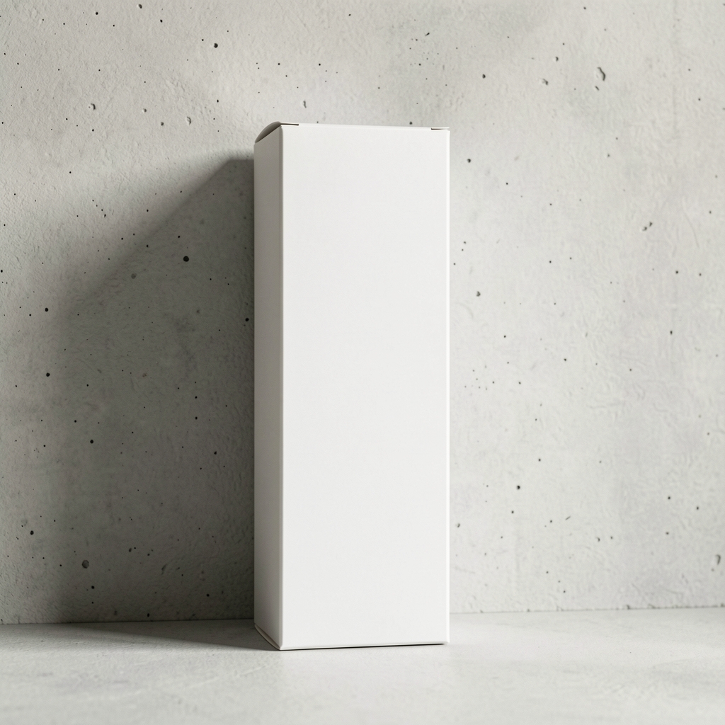 Tall rectangular supplement box with minimal white packaging resting against a pale concrete wall with indirect natural light